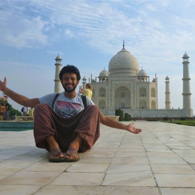 Tourist in front of taj mahal