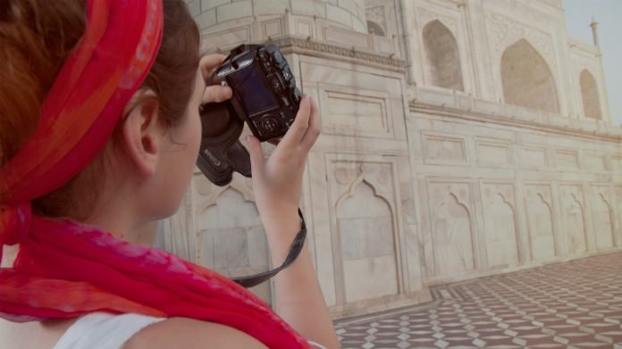 tourist in Taj Mahal with Camera